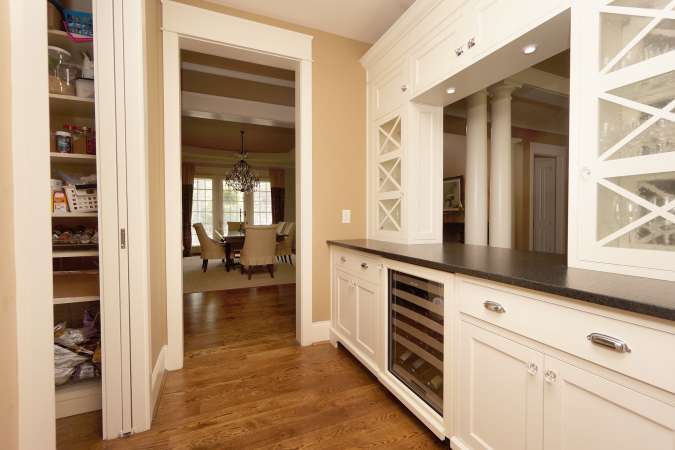 Butler's Pantry With Glass Front Cabinetry, Wine Cooler and Walk-In Pantry