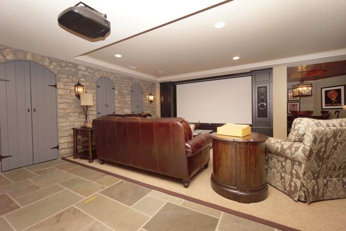 Finished Lower Level With Theatre Room, Surround Sound, Stone Accents & Slate Tile