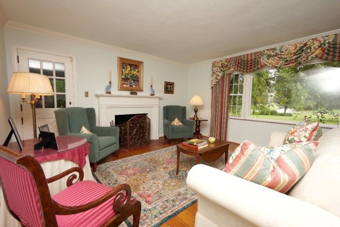 Formal living room with walkout to sunroom