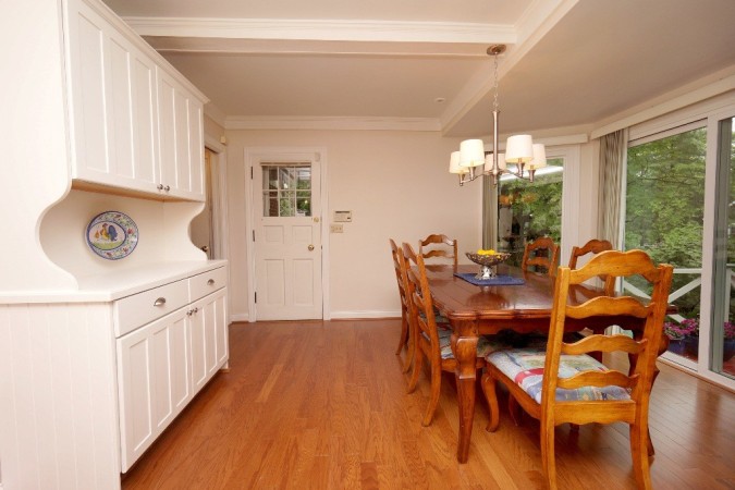 Large breakfast nook with bay window, walkout to side porch and rear courtyard