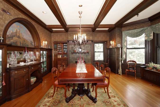 Gorgeous Dining Room with Beamed Ceiling and Fireplace