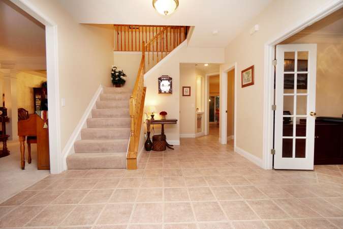 Inviting Foyer with Turned Staircase