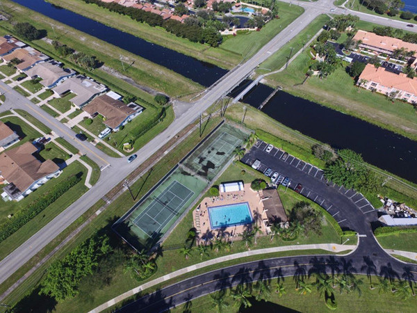 View of the Palm Greens Condo II pool & tennis court area