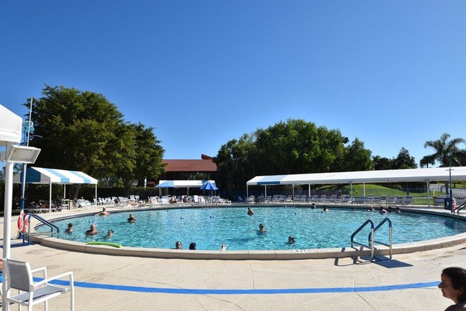 Clubhouse pool features plenty of 'sunny' & 'shady' sitting area