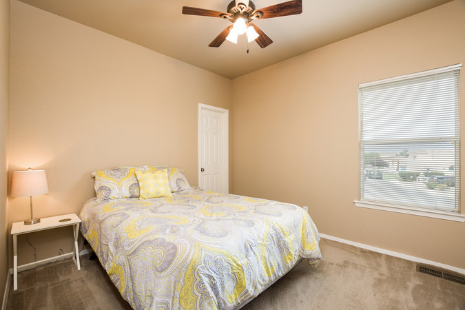 Guest Bedroom 1 with Walk In Closet and Ceiling Fan