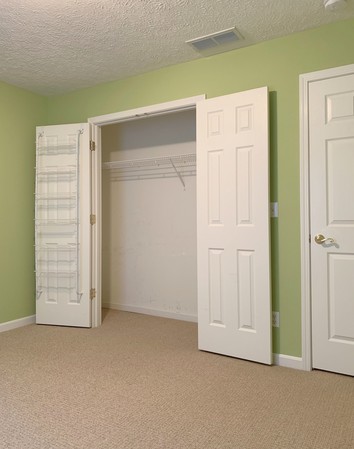 Third bedroom, large double door closets, window faces backyard