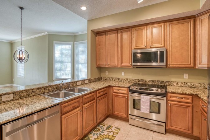 Kitchen with stainless appliances and granite counter